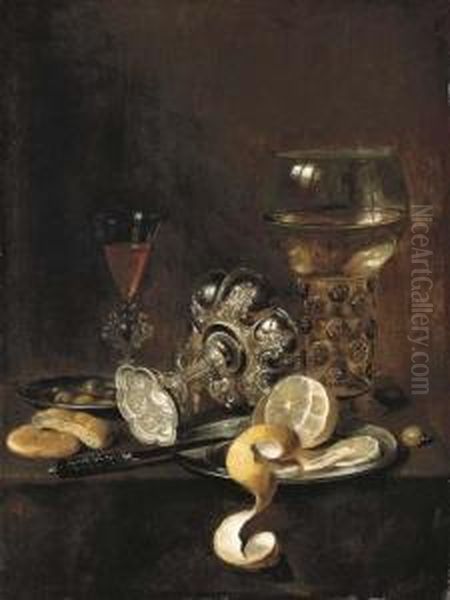 A Giant Roemer, An Upturned 
Goblet, A Glass, Bread, A Knife And A Partly-peeled Lemon On A Platter, 
On A Table Oil Painting by Pieter Claesz.