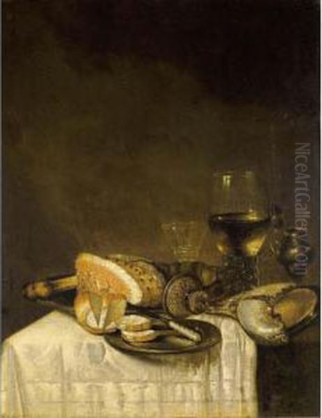 A Still Life With A Nautilus 
Cup, A Roemer, A Wineglass, A Ham, Bread And A Knife On Pewter Plates 
Together With A Silver Gilt Mustard Jar, All On A Table Draped With A 
White Tablecloth Oil Painting by Willem Claesz. Heda