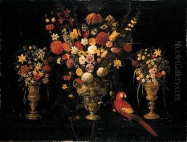 Tulips, Carnations, Irises, 
Daffodils, Hyacinths And Other Flowersin Three Ornamental Silver-gilt 
Standing Cups With A Parrot And Achained Squirrel Oil Painting by Astolfo Petrazzi