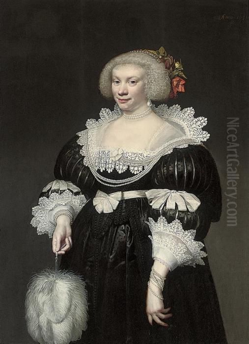 Portrait Of A Lady, 
Three-quarter Length, In A Black Slashed Silkdress With Lace Collar And 
Cuffs, A Fan In Her Right Hand Oil Painting by Jan Anthonisz Van Ravesteyn