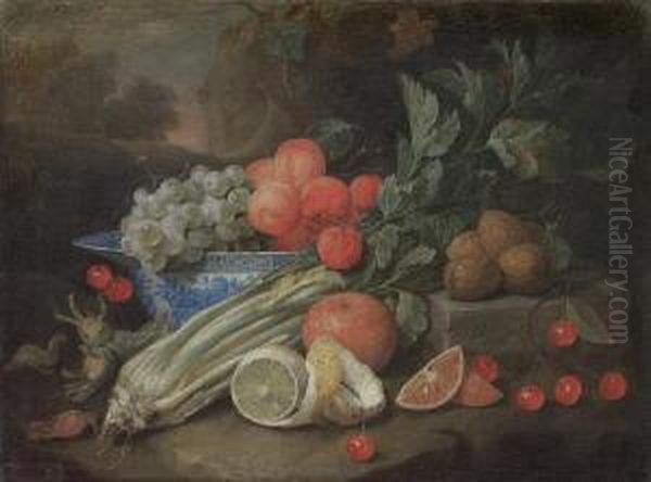 Apricots And Grapes In A Wan-li 
Kraak Blue Andwhite Bowl On A Table Ledge, With A Peeled Lemon, Celery, 
Cherriesand Walnuts, Before A Landscape Oil Painting by Joris Van Son