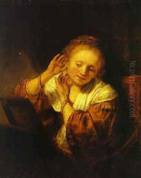 A Young Woman Trying on Earings Oil Painting by Harmenszoon van Rijn Rembrandt