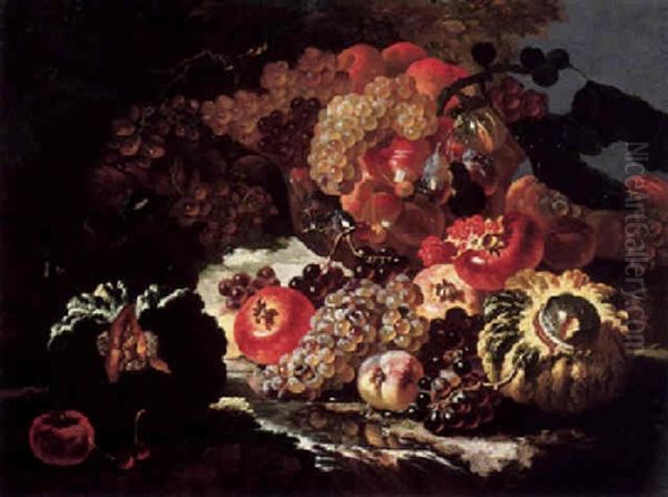Still Life Of Grapes, Cherries, Plums, Figs, Pomegranates, Melons, And Other Fruits, Some In A Glass Bowl, Set In A Landscape By A Stream Oil Painting by Giovanni Paolo Castelli (lo Spadino)