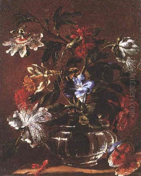 A Still Life Of A Passion Flower, Daffodill, Carnation And Other Flowers In A Glass Vase Beside A Split Fig On A Stone Ledge Oil Painting by Mario Nuzzi Mario Dei Fiori