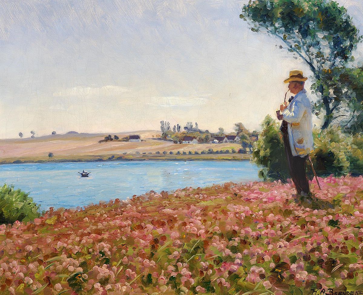 A man in a white coat enjoying the view across an inlet. Oil Painting by H. A. Brendekilde